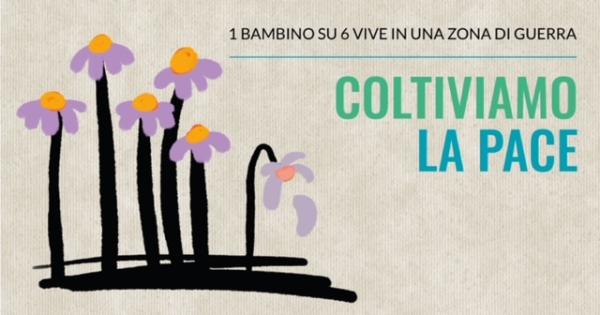 Fiori e slogan "Coltiviamo la pace"